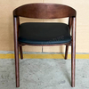 Factory Direct Sales of Modern Design Walnut-colored Solid Wood Dining Chairs with Laser-engraved, Nail-free Seat Panels And PU Cushions.